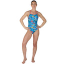 Woman wearing a colorful swimsuit with a white background