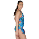 Woman wearing a blue floral swimsuit on a white background