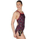 Woman wearing a patterned swimsuit on a white background