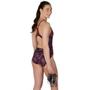 Woman wearing a patterned swimsuit on a white background