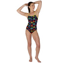 Woman wearing a colorful one-piece swimsuit with geometric pattern on a white background