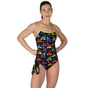 Woman wearing a colorful one-piece swimsuit with shark pattern on a white background