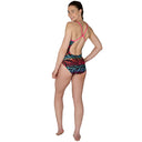Woman wearing a colorful swimsuit with zebra pattern on a white background