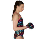 Woman wearing a colorful swimsuit with matching boxing gloves on a white background
