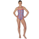 Woman wearing a colorful swimsuit with a pattern on a white background