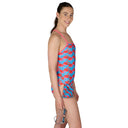 Woman wearing a colorful swimsuit with a white background