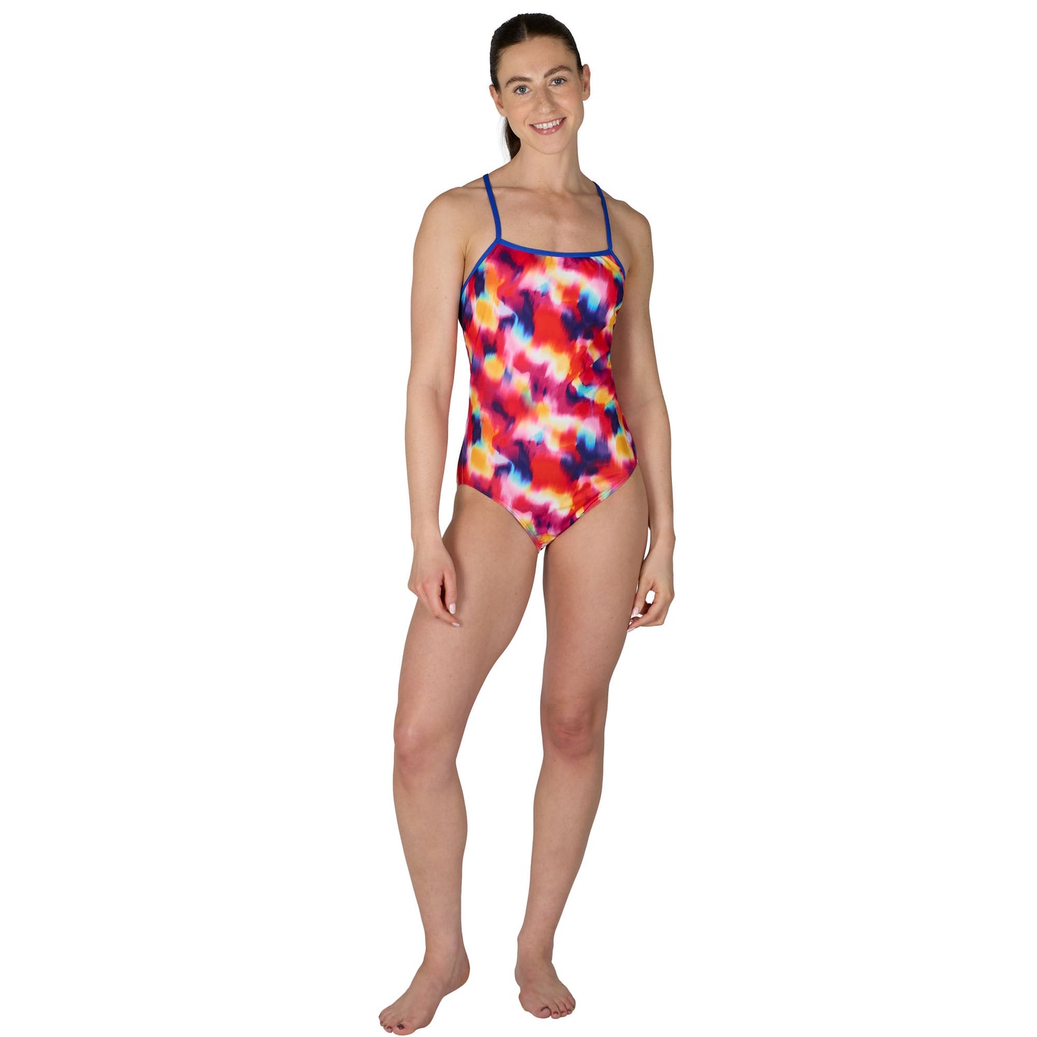 Woman wearing a colorful tie-dye swimsuit on a white background