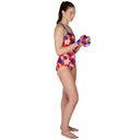 Woman wearing a colorful swimsuit holding boxing gloves on a white background